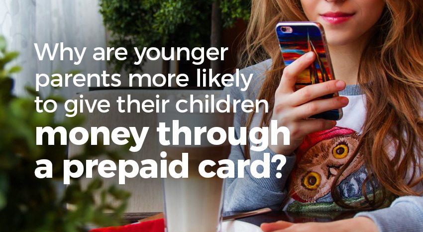 Younger parents giving children money on prepaid card